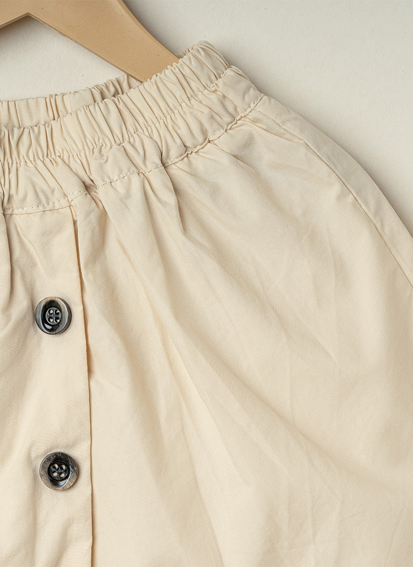 Cream Ruffle Button Shorts