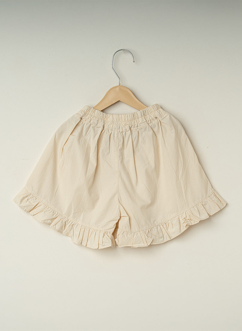 Cream Ruffle Button Shorts